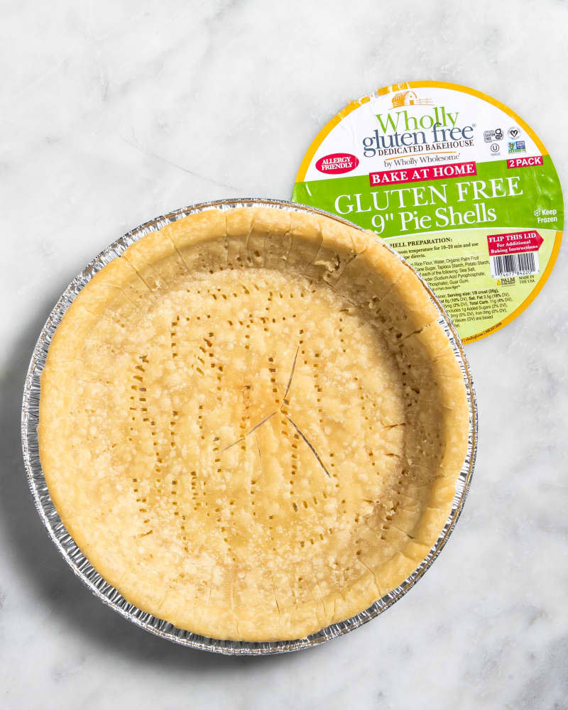 Overhead view of a baked, plain, Wholy 
wholesome gluten free brand frozen pie crust.