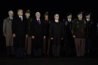 President Donald Trump and Vice President Mike Pence watches as a U.S. Army carry team salutes the transfer case's containing the remains of Sgt. 1st Class Javier Gutierrez, of San Antonio, Texasa and Sgt. 1st Class Antonio Rodriguez, of Las Cruces, N.M., Monday, Feb. 10, 2020, at Dover Air Force Base, Del. According to the Department of Defense both died Saturday, Feb. 8, during combat in Afghanistan. (AP Photo/Evan Vucci)