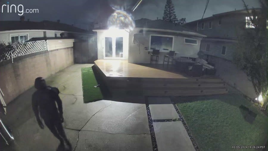 A suspect lurking in the backyard of a Westchester home in Los Angeles County amid a series of violent break-ins.