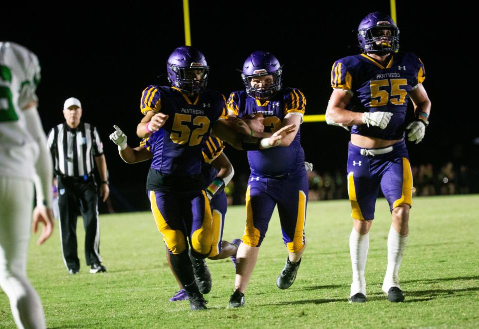Cypress Lake High School student, Peyton Melton runs for a touchdown in a pre-arranged extra play against Fort Myers High School on Friday, Oct. 27, 2023. The special needs student is a big sports fan and supporter of the team.
