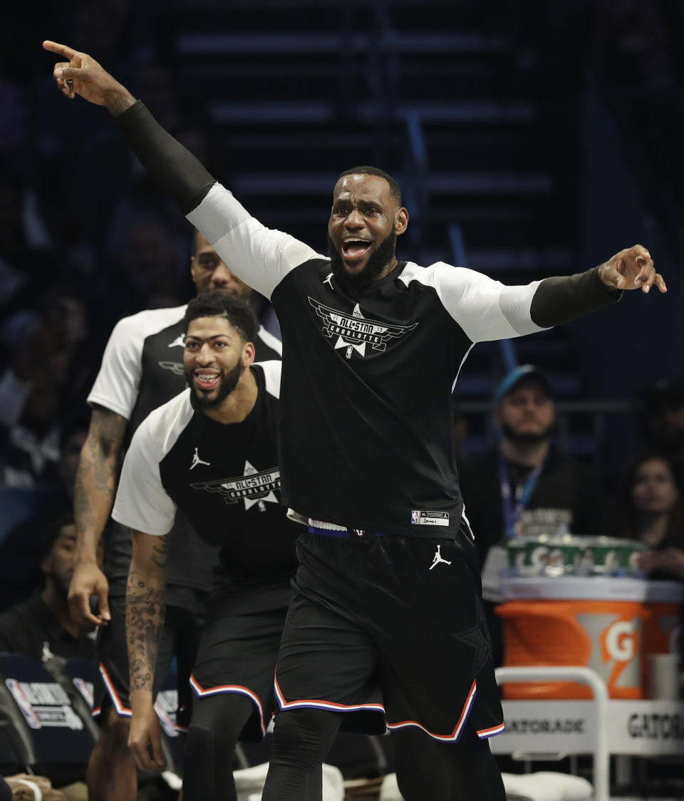 CORRECTS TO THE LAKERS, NOT THE CAVALIERS - Team LeBron's LeBron James, of the Los Angeles Lakers, celebrates a basket against Team Giannis during the second half of an NBA All-Star basketball game, Sunday, Feb. 17, 2019, in Charlotte, N.C. (AP Photo/Chuck Burton)