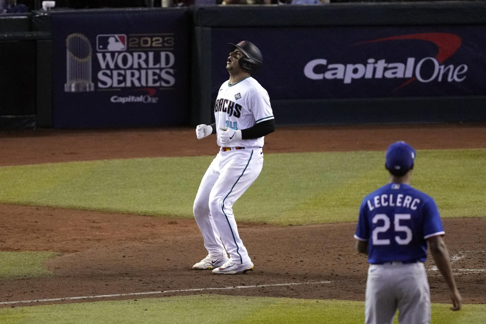 Arizona Diamondbacks' Gabriel Moreno (14) reacts after a called strike during the ninth inning in Game 3 of the baseball World Series against the Texas Rangers Monday, Oct. 30, 2023, in Phoenix. The Rangers won 3-1. (AP Photo/Ross D. Franklin)