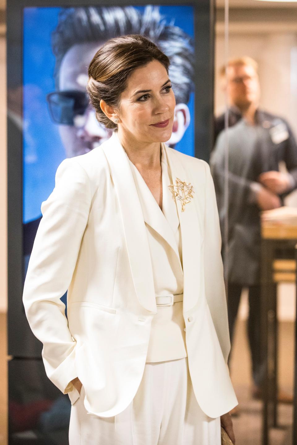 Crown Princess Mary of Denmark wearing a white pantsuit