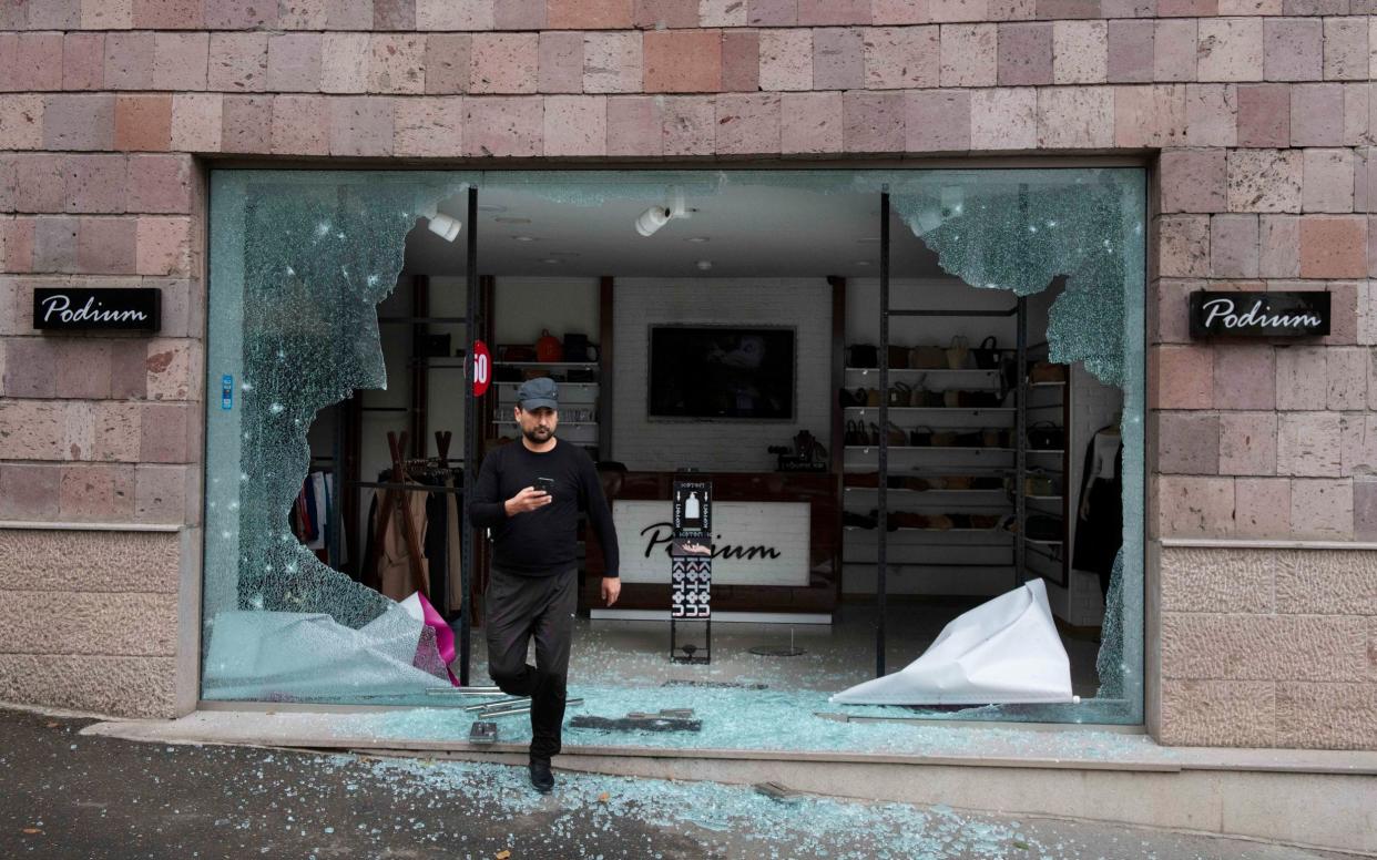 Shattered glass in a bomb-damaged store front in Stepanakert - Julian Simmonds