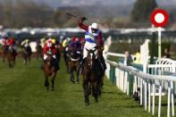 Britain Horse Racing - Grand National Festival - Aintree Racecourse - 8/4/17 Derek Fox on One For Arthur celebrates as he wins the 5:15 Randox Health Grand National Action Images via Reuters / Jason Cairnduff Livepic