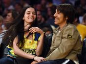 <p>Wanessa Milhomem and Anthony Kiedis of The Red Hot Chili Peppers sit court-side during the Lakers v. Hawks game in 2015. </p>
