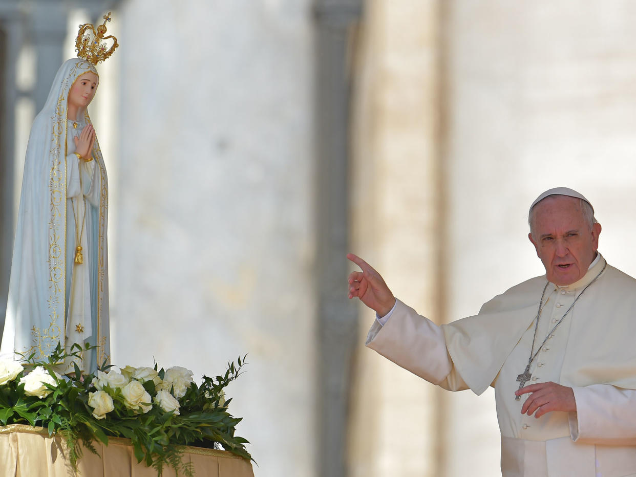 Pope Francis with a figure of Our Lady of Fatima who the group claim predicted the rise of an antipope: AFP/Getty Images