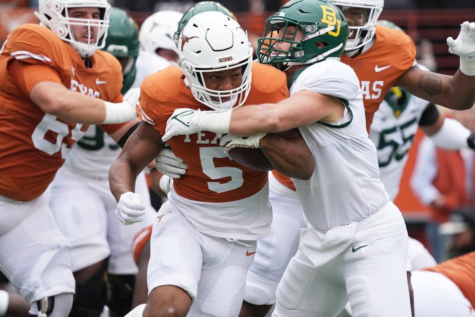Texas running back Bijan Robinson looks for yardage during Saturday's 38-27 win over Baylor. Robinson finished with 29 carries for 179 yards and a pair of touchdowns in the game.