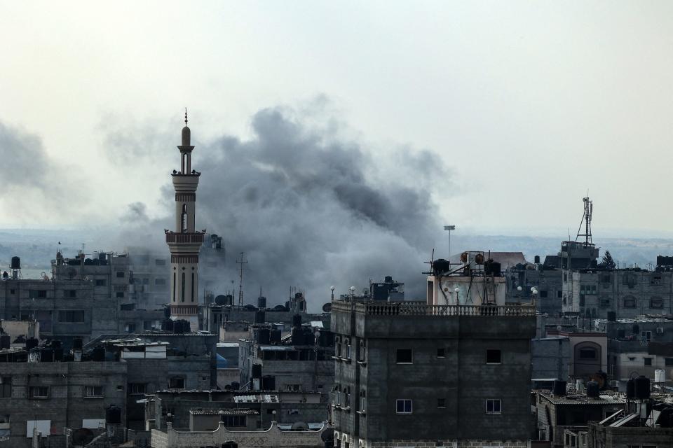 Smoke rises above buildings during an Israeli strike on Rafah near the border with Egypt, in the southern Gaza Strip on Dec. 1, 2023, after battles resumed between Israel and the Hamas movement. A temporary truce between Israel and Hamas expired on December 1, with the Israeli army saying combat operations had resumed, accusing Hamas of violating the operational pause.