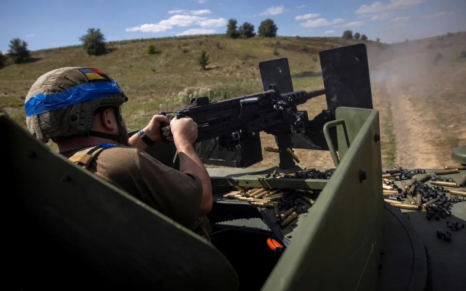 A Ukrainian gunner fires near the Russian border