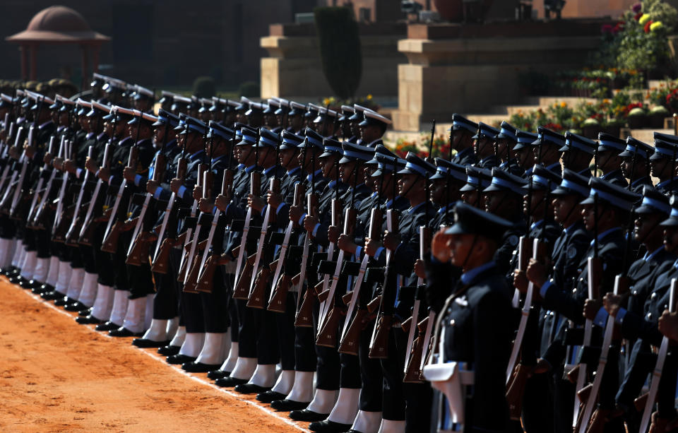 Indian military soldiers present a guard of honor for Brazilian president Jair Bolsonaro during his ceremonial reception in New Delhi, India, Saturday, Jan. 25, 2020. Bolsonaro is this year's chief guest for India's Republic day parade. (AP Photo/Manish Swarup)