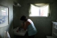 <p>Immigrant Rosa Sabido, 53, brushes her teeth after waking up in the United Methodist Church in which she lives while facing deportation in Mancos, Colo., July 19, 2017. (Photo: Lucy Nicholson/Reuters) </p>