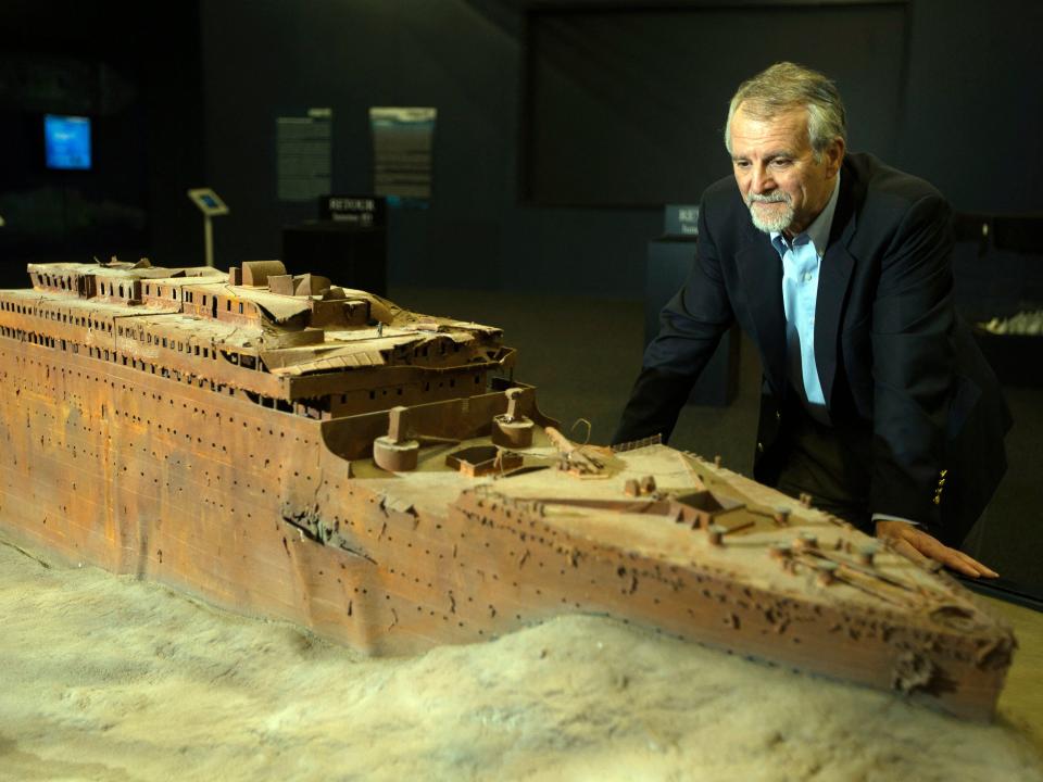 Paul-Henri Nargeolet looks over a replica of the sunken RMS Titanic