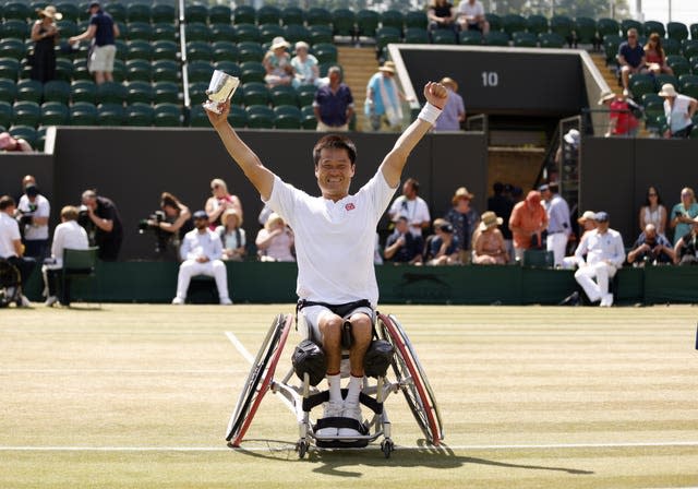 Shingo Kunieda lifts the trophy after his 2022 Wimbledon title