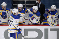 Buffalo Sabres center Casey Mittelstadt (37) is congratulated on his goal during the second period of the team's NHL hockey game against the Washington Capitals, Thursday, April 15, 2021, in Washington. (AP Photo/Nick Wass)