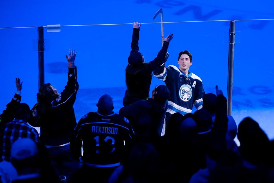 Mar 30, 2024; Columbus, Ohio, USA; Columbus Blue Jackets defenseman Zach Werenski (8) tosses out a stick after being named the game’s first star following the 4-3 shootout win over the Pittsburgh Penguins in the NHL hockey game at Nationwide Arena.