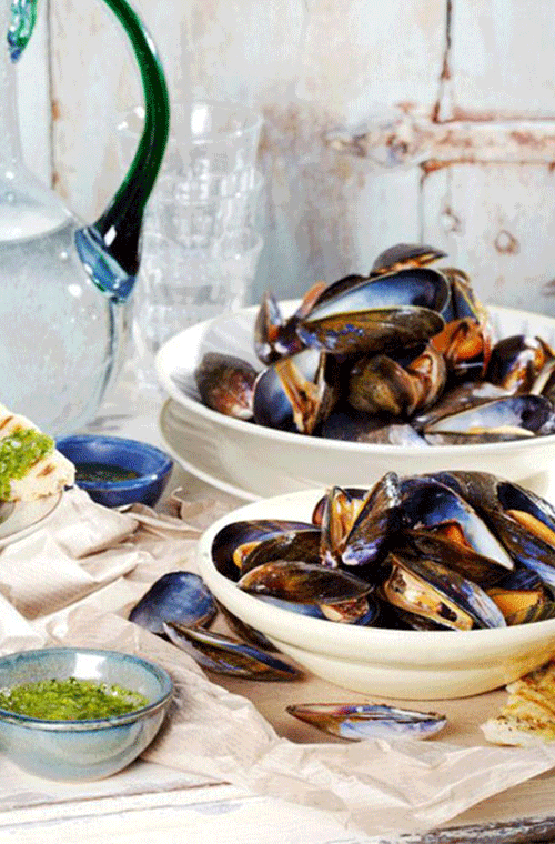 Their toasty hot shells will keep mussels warm while you dip them in pesto sauce. Mop up leftover sauce with grilled bread.<br><br><a rel="nofollow" href="https://au.lifestyle.yahoo.com/better-homes-gardens/recipes/r/31056596/mussels-on-the-barbecue-with-basil-sauce/" data-ylk="slk:Mussels on the barbecue with basil sauce recipe.;elm:context_link;itc:0;sec:content-canvas" class="link ">Mussels on the barbecue with basil sauce recipe.</a>