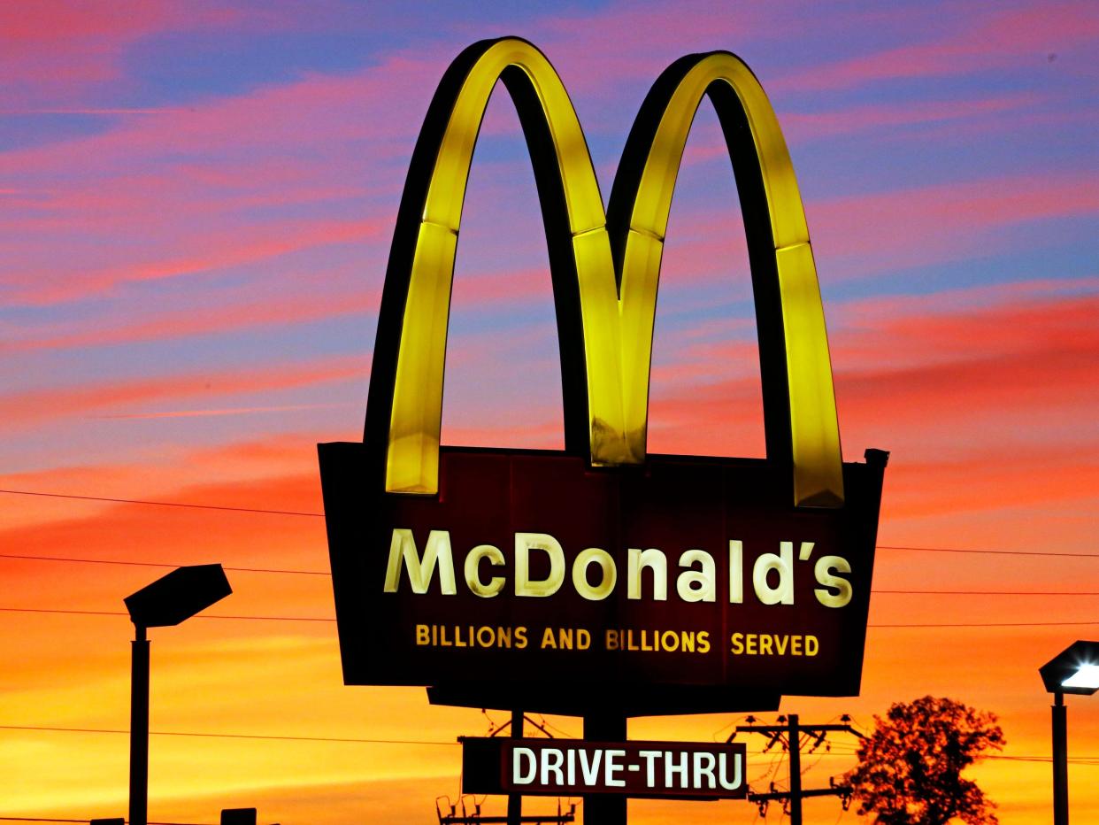 McDonald's arches in front of sunset