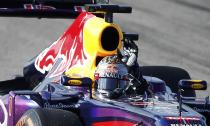 Red Bull Formula One driver Sebastian Vettel of Germany waves to fans after winning the Austin F1 Grand Prix at the Circuit of the Americas in Austin November 17, 2013.