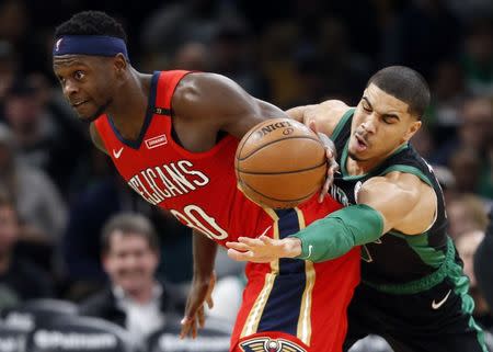 Dec 10, 2018; Boston, MA, USA; Boston Celtics forward Jayson Tatum (0) attempts to steal the ball from New Orleans Pelicans center Julius Randle (30) during the second half at TD Garden. Greg M. Cooper-USA TODAY Sports