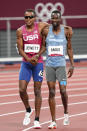 Isaiah Jewett, of the United States, and Nijel Amos, right, of Botswana, walk off after falling in the men's 800-meter semifinal at the 2020 Summer Olympics, Sunday, Aug. 1, 2021, in Tokyo. (AP Photo/Jae C. Hong)