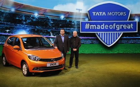 Chairman of Tata Group, Cyrus Mistry and Tata Motors' Head of Advanced and Product Engineering, Tim Leverton (R), pose with a Zica car during its launch at the Indian Auto Expo in Greater Noida, February 3, 2016. REUTERS/Anindito Mukherjee