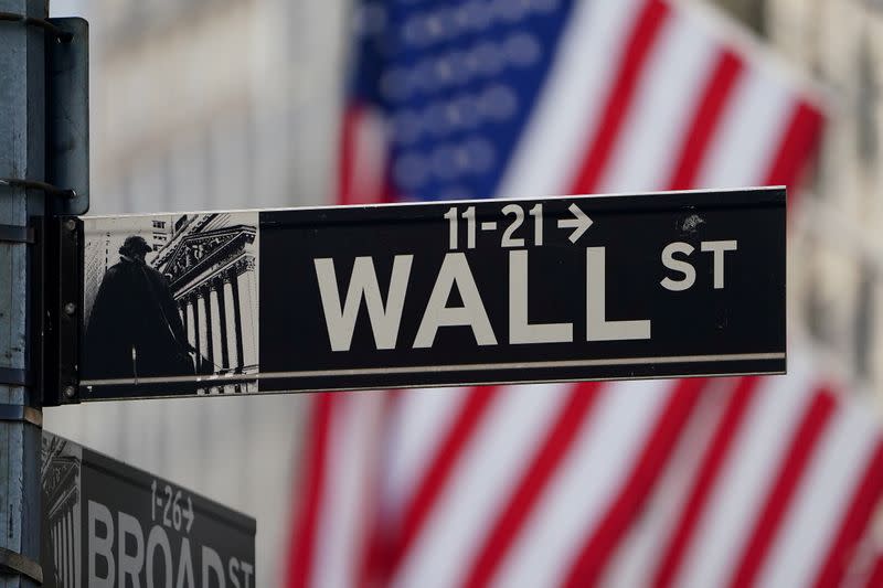 FILE PHOTO: The Wall Street sign is pictured at the New York Stock exchange (NYSE) in the Manhattan borough of New York City