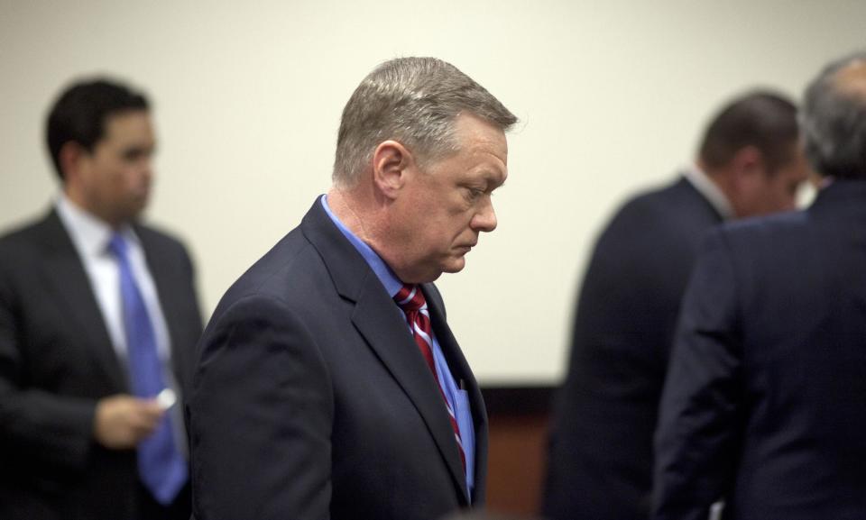 FILE - In this Feb. 21, 2013, file photo, Former Fiesta Bowl CEO John Junker appears in Maricopa County Superior Court in Phoenix, Ariz. Junker, who acknowledged participating in an illegal campaign contribution scheme, faces sentencing Thursday, March 13, 2014, in federal court. Junker pleaded guilty two years ago to a federal conspiracy charge after being accused of being involved in the scheme in which Fiesta Bowl employees made illegal campaign contributions to politicians and were reimbursed by the nonprofit bowl. (AP Photo/The Arizona Republic, Mark Henle, File) MARICOPA COUNTY OUT; MAGS OUT; NO SALES.