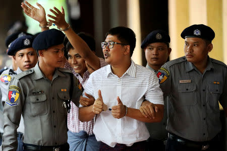 FILE PHOTO: Detained Reuters journalists Wa Lone and Kyaw Soe Oo arrive at Insein court in Yangon, Myanmar August 27, 2018. REUTERS/Ann Wang
