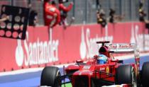 Ferrari's Spanish driver Fernando Alonso celebrates winning at the Valencia Street Circuit in Valencia during the European Formula One Grand Prix