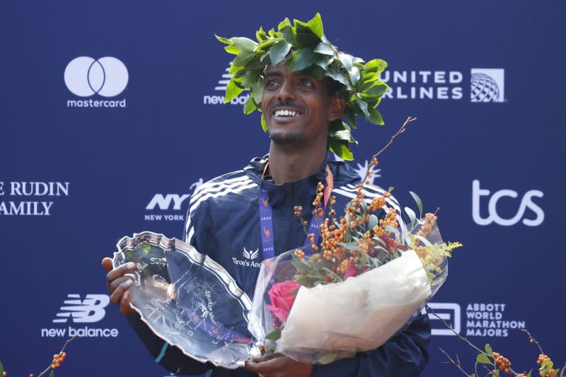 Tamirat Tola of Ethiopia celebrates after winning the Men's race at the 2023 New York Marathon. Photo by John Angelillo/UPI