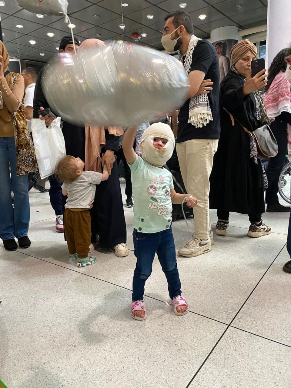 PHOTO: Saja Bilal Junaid, 3, arrives at John F. Kennedy International Airport in New York on May 5, 2024. She suffered third-degree burns to her face after an Israeli airstrike hit her home. (Palestine Children's Relief Fund)