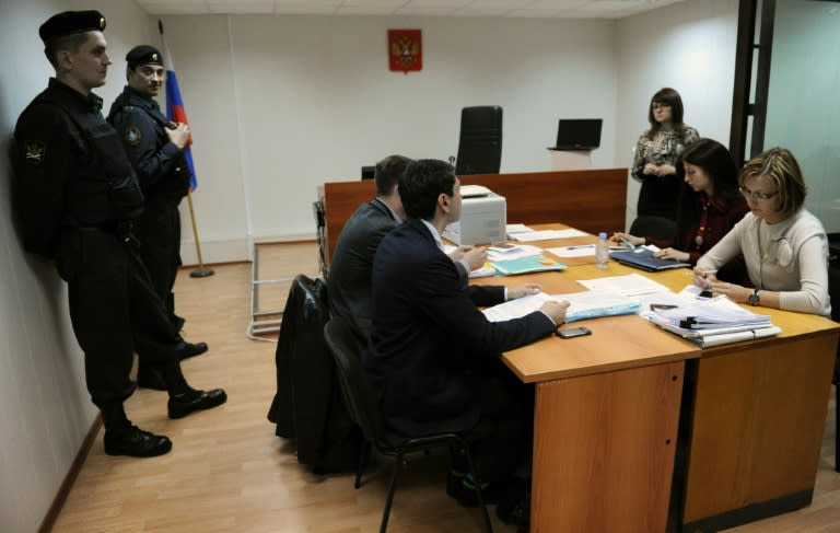 Court officials and lawyers attend the hearing of the NGO Golos (Voice) case in Moscow, on April 25, 2013, when Russian court heard a case against Golos over its alleged failure to declare its status as a "foreign agent"