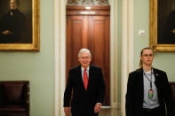 U.S. Senate Majority Leader McConnell enters the Senate Chamber Floor after Congress agreed to a multi-trillion dollar economic stimulus package created in response to the economic fallout from the COVID-19 Coronavirus, on Capitol Hill in Washington