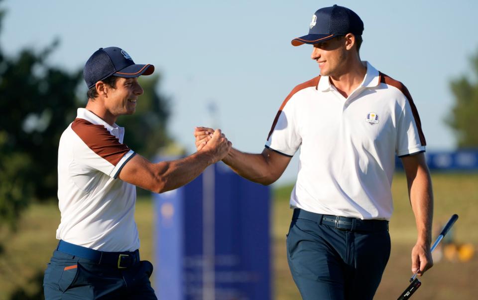 Europe's Ludvig Aberg, right, and playing partner Europe's Viktor Hovland celebrate