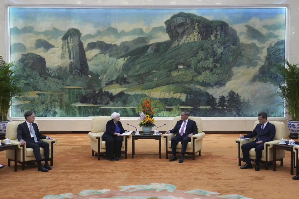 U.S. Treasury Secretary Janet Yellen, center left, meets Chinese Premier Li Qiang at the Great Hall of the People in Beijing, China, Sunday, April 7, 2024. Yellen, who arrived later in Beijing after starting her five-day visit in one of China's major industrial and export hubs, said the talks would create a structure to hear each other's views and try to address American concerns about manufacturing overcapacity in China. (AP Photo/Tatan Syuflana, Pool)