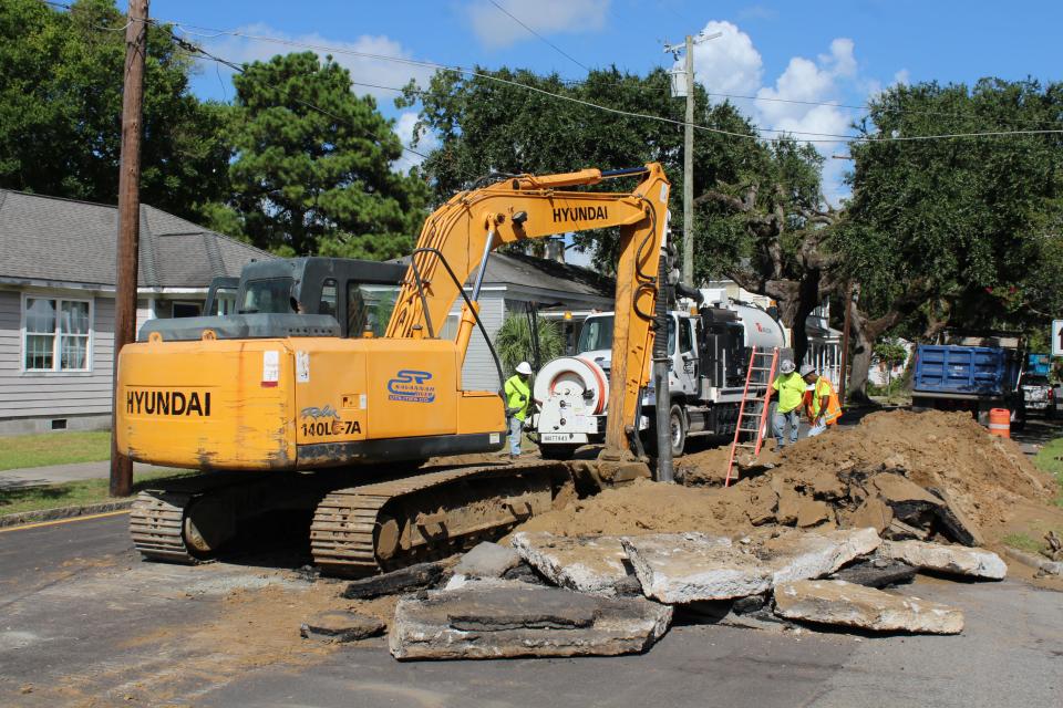 Crews repair a sewer main in July 2020
