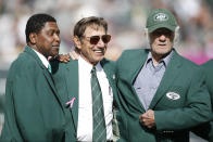 FILE - Former New York Jets wide receiver Wesley Walker, left, Hall of Fame quarterback Joe Namath, center, and Hall of Fame wide receiver Don Maynard, right, participate in a New York Jets Ring of Honor ceremony honoring former Jets defensive tackle Marty Lyons during a halftime ceremony of an NFL football game between the New York Jets and the Pittsburgh Steelers Sunday, Oct. 13, 2013, in East Rutherford, N.J. Don Maynard, a Hall of Fame receiver who made his biggest impact catching passes from Joe Namath in the wide-open AFL, has died. He was 86. The Pro Football Hall of Fame confirmed Maynard's death on Monday, Jan. 10, 2022, through his family. (AP Photo/Kathy Willens, File)