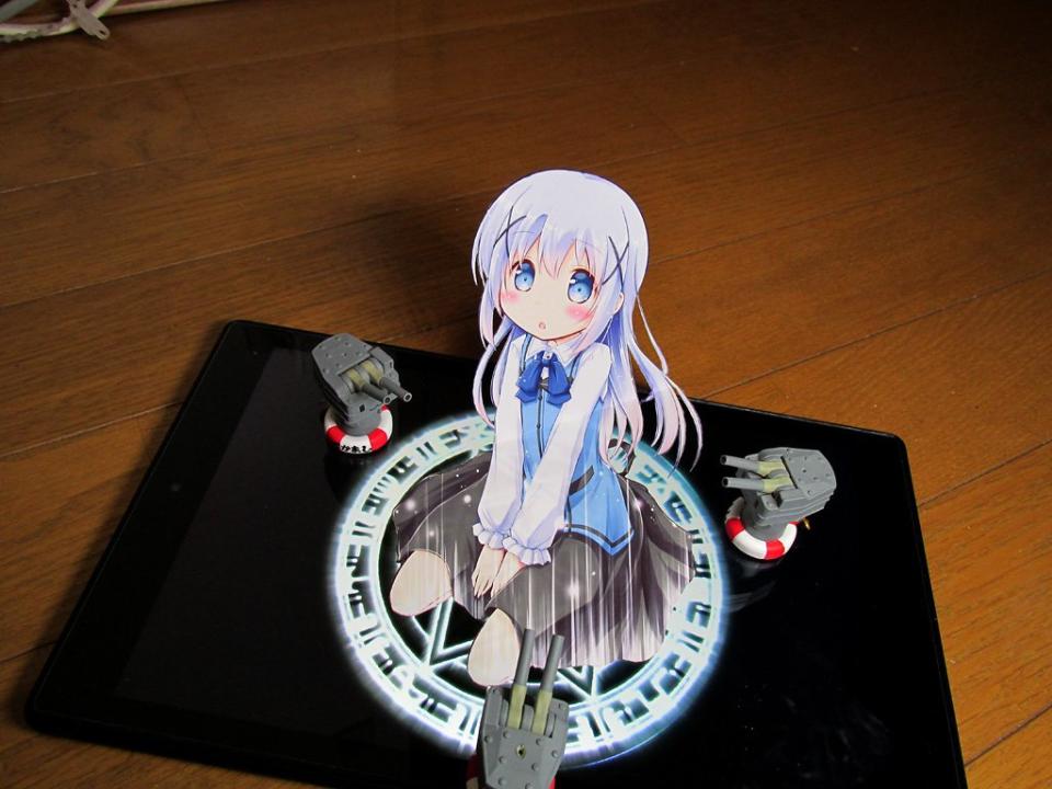 The most interesting of all is probably this cut-out illustration with a magic circle on a tablet, summoning the character from “Is the Order a Rabbit?”. (Photo: Twitter @mina_naya)