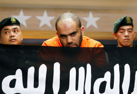 Egyptian national Fehmi Lassoued is presented to members of the media after being arrested allegedly in possession of assorted explosives and bomb-making paraphernalia during a press conference at the Philippine National Police general headquarters in Quezon City, Metro Manila, Philippines February 19, 2018. REUTERS/Dondi Tawatao