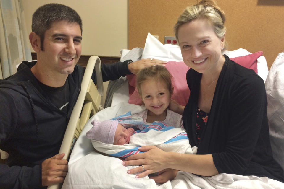 This Aug. 9 2018 photo provided by Amy Bianchi of Albany, N.Y. shows her with her newborn son, Brayden, with his father, Christopher, and sister, Mia, at Bellevue Woman’s Center in Niskayuna, N.Y. (Courtesy Amy Bianchi via AP)