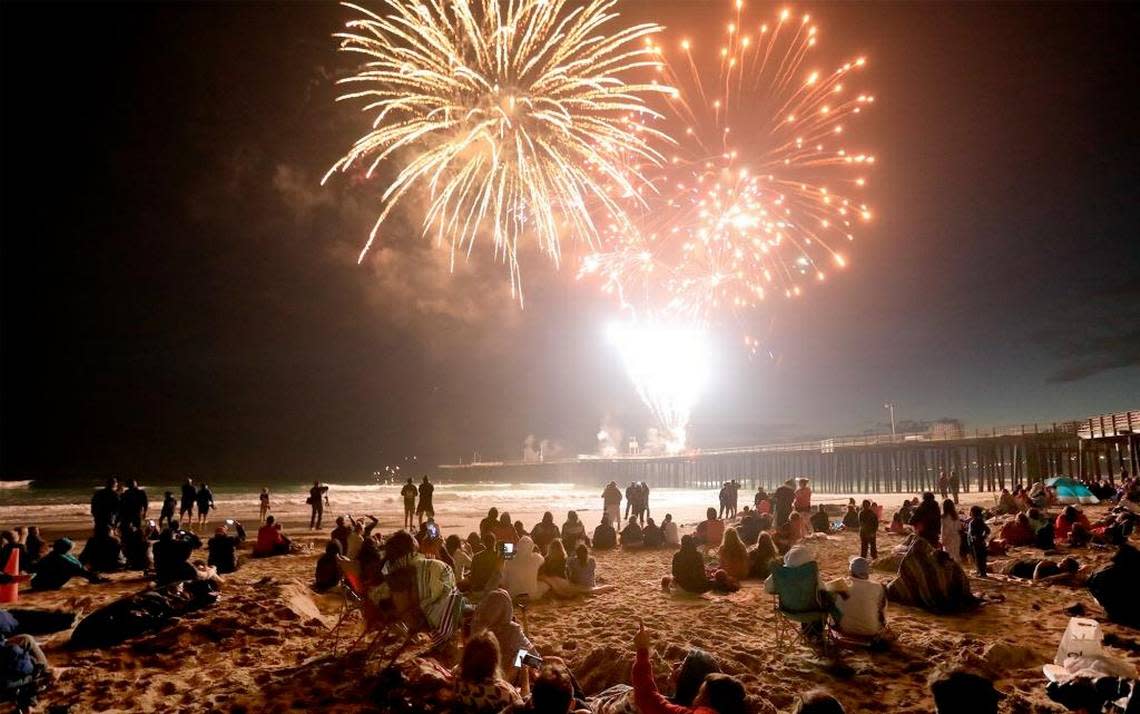 Beachgoers watch the Pismo Beach fireworks show in 2017.