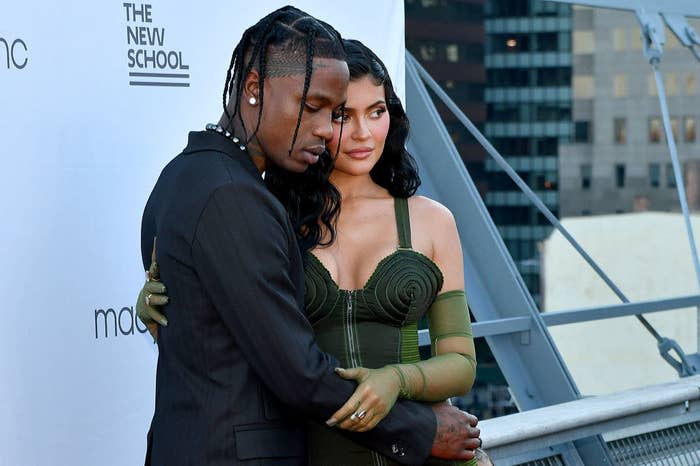 The couple posing together for a photo at a red carpet event