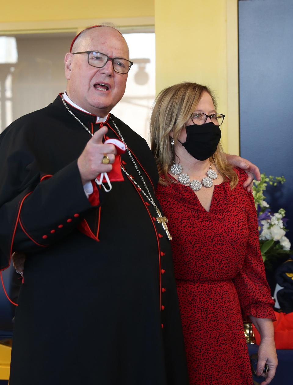 Our Lady of Lourdes president Catherine Merryman, shown here with Cardinal Timothy Dolan in the new athletic facility at Our Lady of Lourdes High School in Poughkeepsie Feb. 10, 2021, has been meeting with Ossining administrators and family members of a player who was the target of a racist shout in a Section 1 girls basketball playoff game on Feb. 26, 2022.