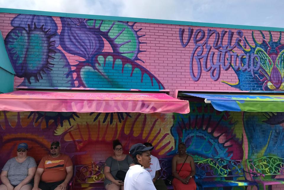 Tiffany Machler's "Indigenous Fly Feaster," on the side of  Kate's Pancake House, is part of the Carolina Beach Mural Project.