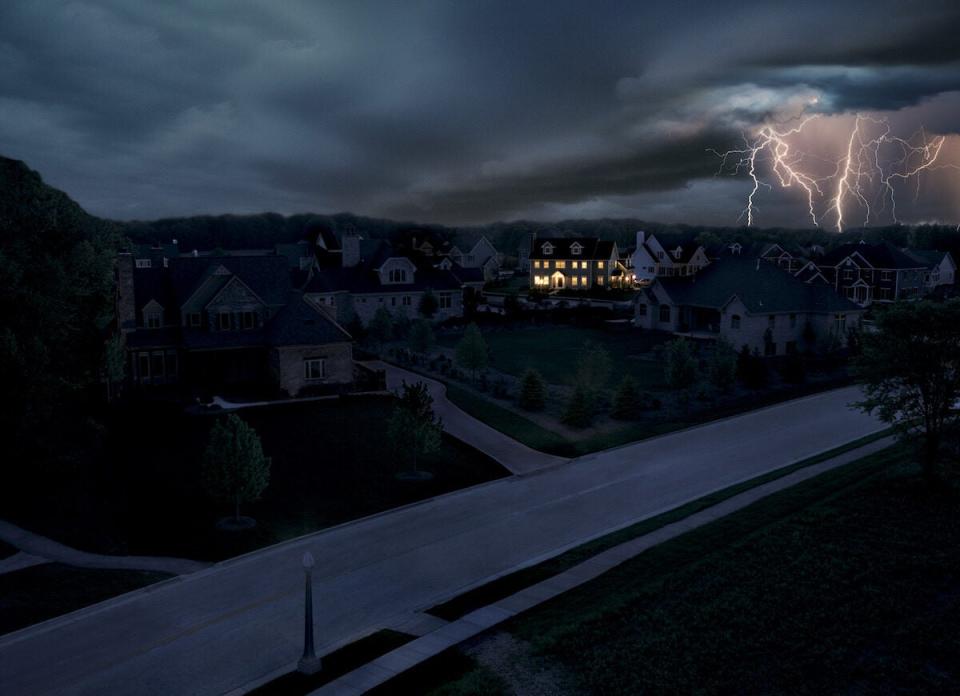 neighborhood storm with one house powered on because of a standby generator