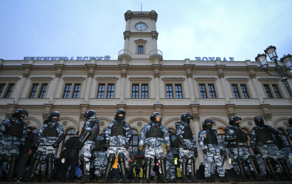 Police stand guard during a protest against the jailing of opposition leader Alexei Navalny in Moscow, Russia, on Sunday, Jan. 31, 2021. Chanting slogans against President Vladimir Putin, thousands of people took to the streets Sunday across Russia's vast expanse to demand the release of jailed opposition leader Alexei Navalny, keeping up the nationwide protests that have rattled the Kremlin. (AP Photo/Alexander Zemlianichenko)