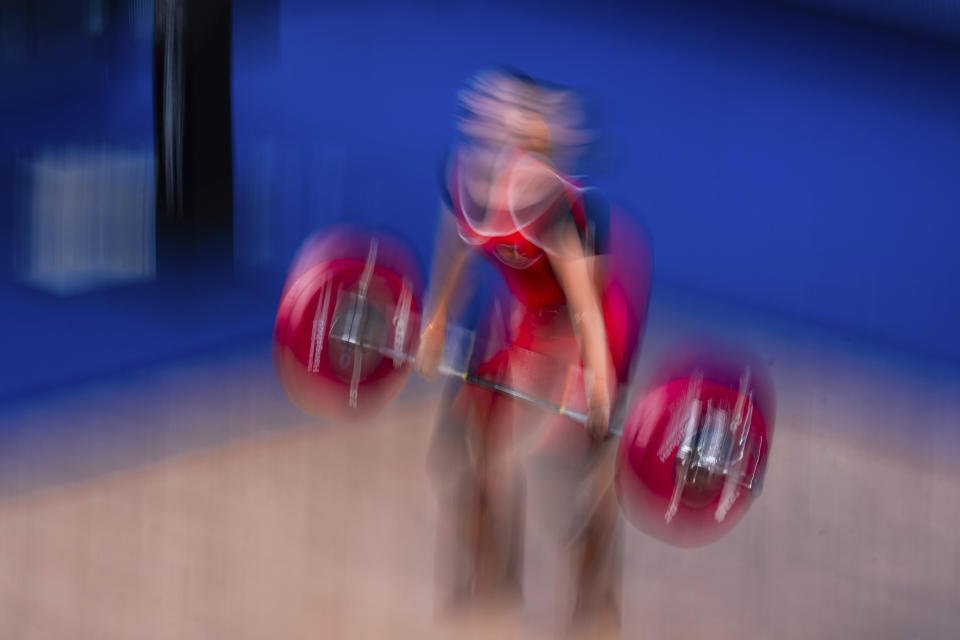 Indonesia's Ramadani Tsabitha competes in the women's 64kg group B weightlifting competition at the 19th Asian Games in Hangzhou, China, Monday, Oct. 2, 2023. (AP Photo/Louise Delmotte)