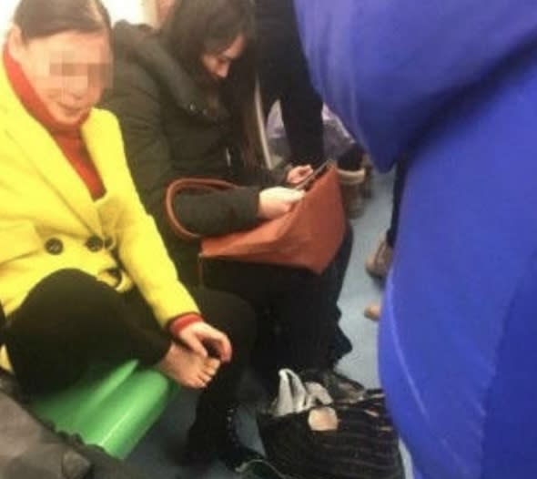 Nice! Woman cuts her toenails on Tube