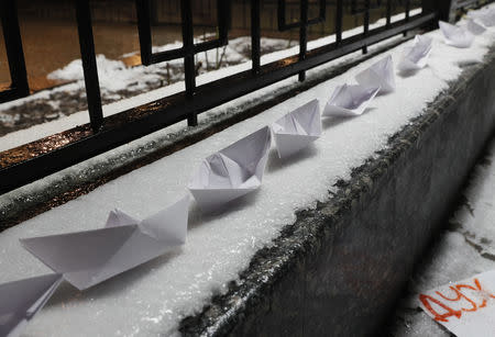 Paper boats are seen placed during a protest against the seizure by Russian special forces of three of the Ukrainian navy ships, which Russia blocked from passing through the Kerch Strait into the Sea of Azov in the Black Sea, in front of the Russian embassy in Kiev, Ukraine November 25, 2018. REUTERS/Gleb Garanich